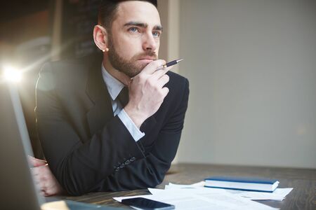 Portrait of Businessman Solving Problems