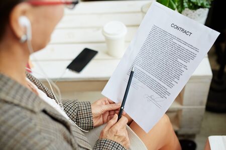 Female Hands with Business Contract