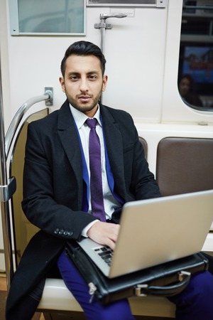 Handsome Businessman with Laptop in Subwayの写真素材