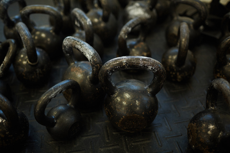Kettlebells on Metal Floor in Gymの写真素材