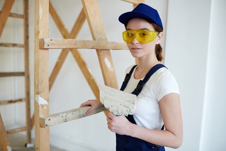 Female Builder Doing Plaster Worksの写真素材