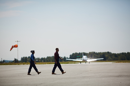 Airport Workers on Runway Fieldの写真素材