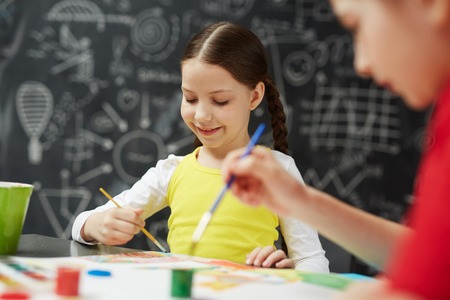 Little Girl Enjoying Paintingの写真素材