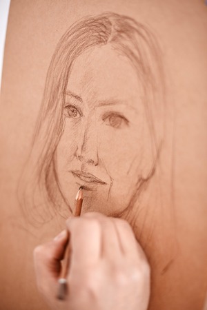 Artist Drawing Sketch of Womans Faceの写真素材