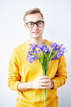 Handsome Guy with Beautiful Irisesの写真素材