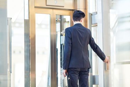 Businessman by the doorの写真素材