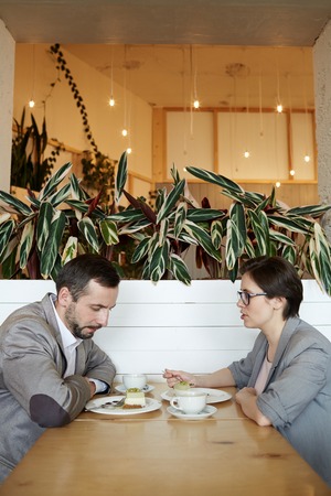 Confused Couple at Lunch in cafe