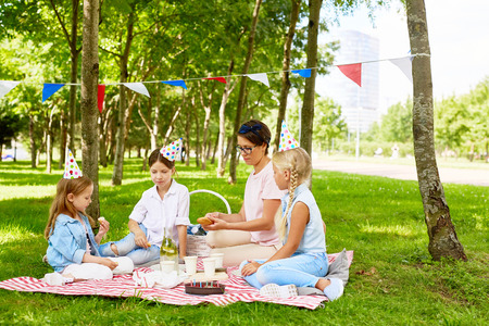 Family having picnic for birthday celebrationの写真素材