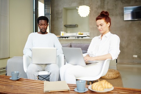 Young Managers Wrapped up in Workの写真素材