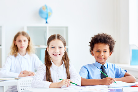 Kids by desksの写真素材