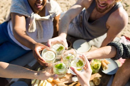 Cheering with mojitoの写真素材