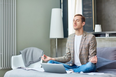Young Freelancer Practicing Yogaの写真素材