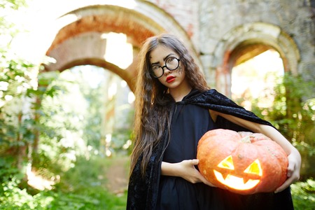 Girl with pumpkinの写真素材