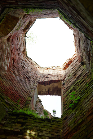 Below view of round half ruined and abandoned citadel wallsの写真素材