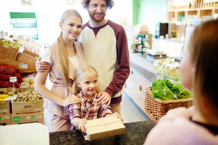 Family by cash registerの写真素材