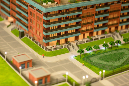 Street in new block of flats and park on layout of modern cityの写真素材