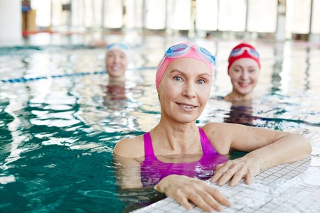 Friends in swimming-poolの写真素材