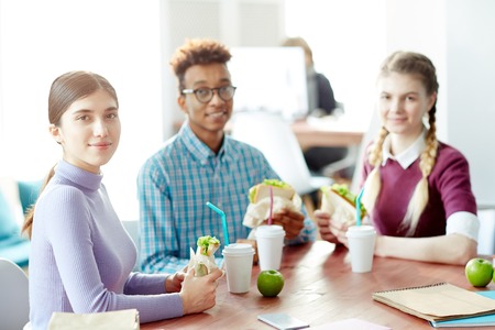 College students having lunchの写真素材