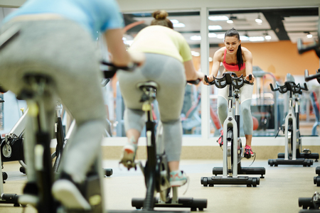 Girls on fitness bikesの写真素材