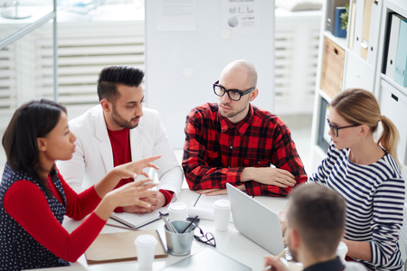 Business people having brainstorm while sitting at the table during a meetingの写真素材