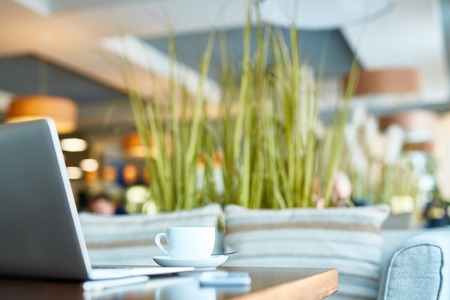 Cup of coffee on the table at coffee shopの写真素材
