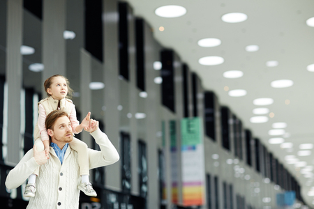 Man with daughter in airportの写真素材