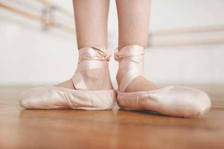 Female legs in pointe on parquetの写真素材