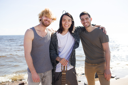 Young friends with guitarの写真素材