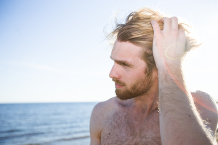 Handsome man on beachの写真素材