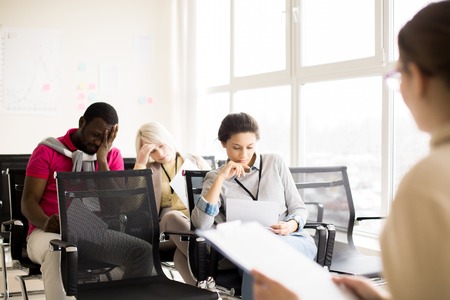 Multiracial group of people doing business tasks on seminarの写真素材