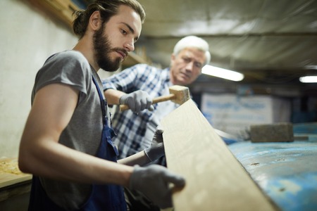 Working with wooden boardの写真素材