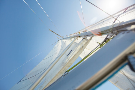 White sail on blue sky