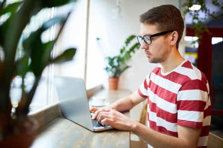 Typing on window-sillの写真素材