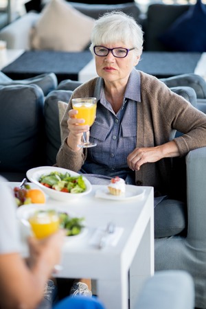 Senior Businesswoman in Cafeの写真素材