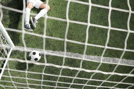 Ball in gate and goalkeeperの写真素材