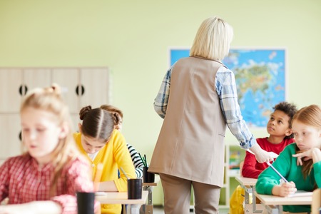 Teacher commenting mistakes of students