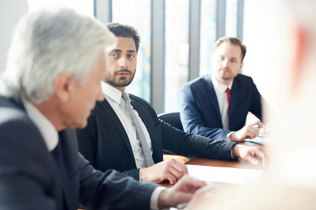 Listening to mature delegateの写真素材