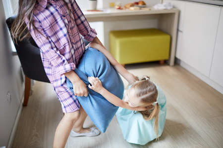 Having fun with pillowの写真素材