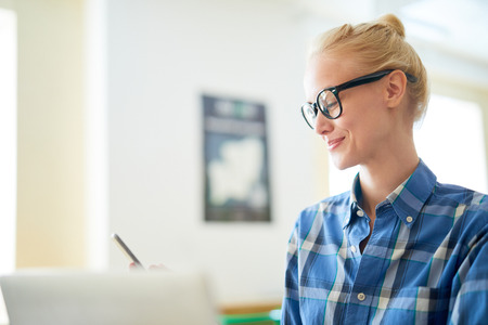 Texting at workの写真素材