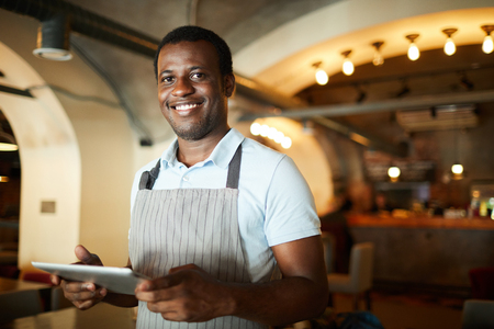 Waiter in restaurantの写真素材