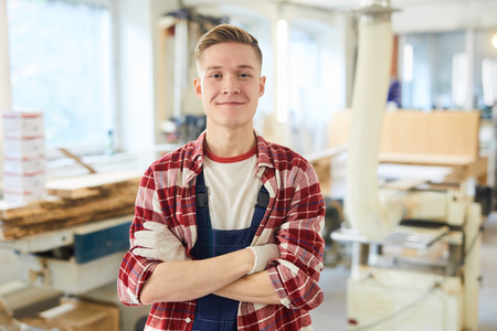 Confident carpentry student in work glovesの写真素材