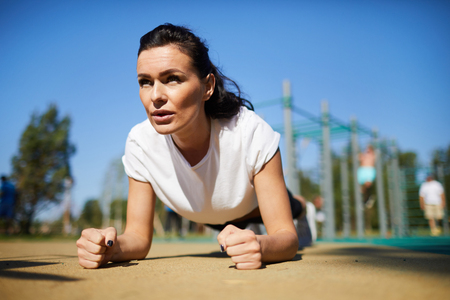 Athletic woman concentrated on exerciseの写真素材