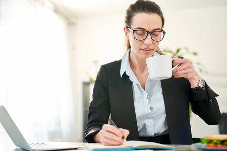 Young Businesswoman Drinking Coffeeの写真素材