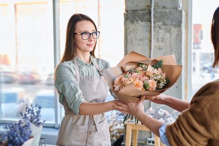 Florist serving clientの写真素材