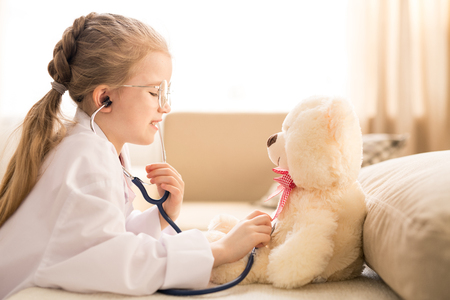 Girl playing doctorの写真素材