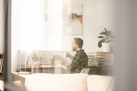 Having drink at workの写真素材