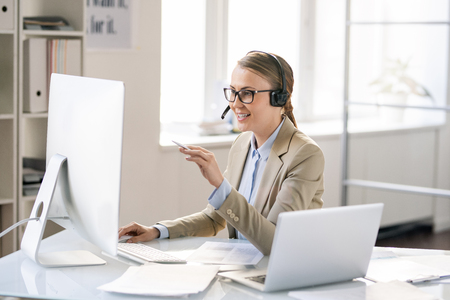 Call center representative solving technical problem of clientsの写真素材