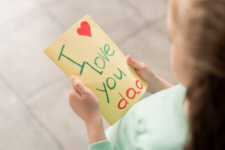 Preparing postcard for father