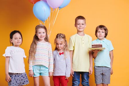 Group of five cute birthday kids in casualwearの写真素材