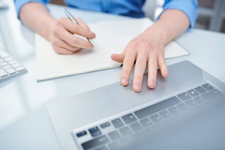 Young man entering the system or choosing online video